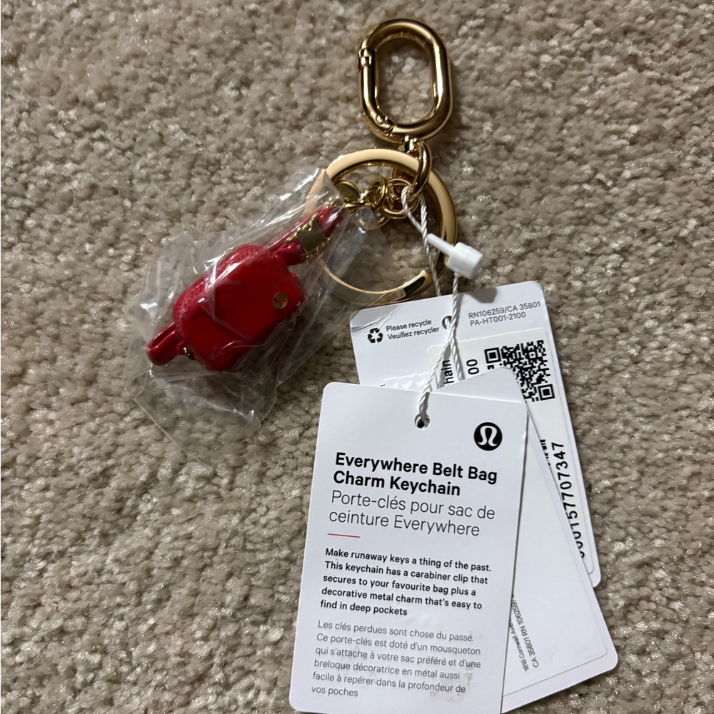 NWT Everywhere Belt Bag Charm Keychain Lulu red sold out